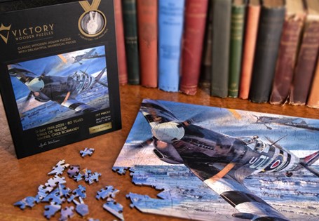 This D-Day Jigsaw Puzzle features artwork by renowned artist Spike Wademan. Includes solid wooden pieces and unique "whimsy" pieces reflecting iconic shapes of World War II. Only 499 issued worldwide.